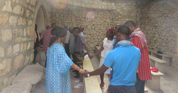  The pilgrims praying for peaceful elections while in Jerusalem